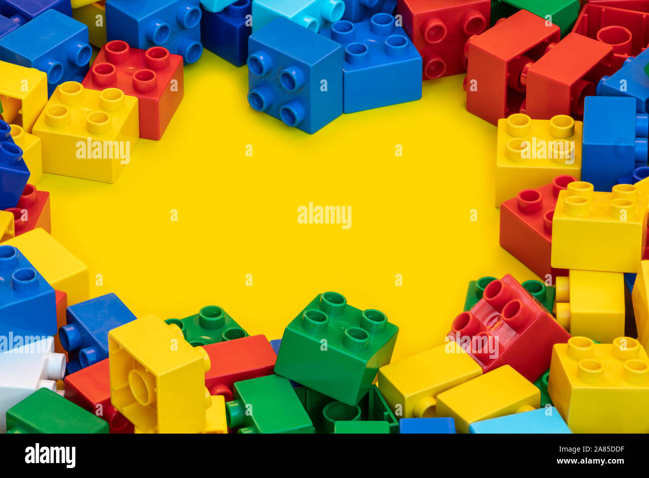 Colorful plastic building blocks toy bricks with place for you text and