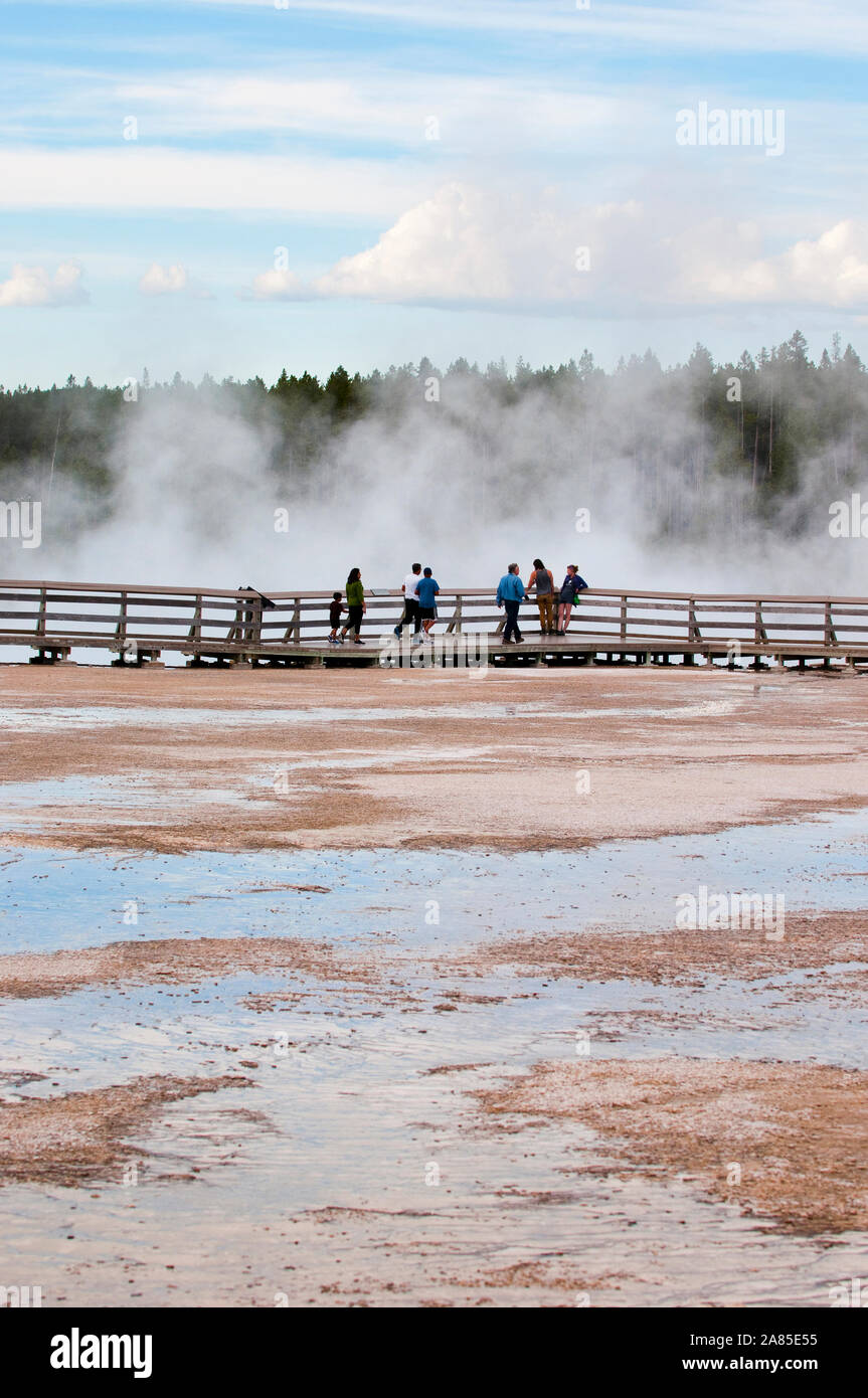 People on a boardwalk at Upper Geyser Basin, Yellowstone National Park Stock Photo