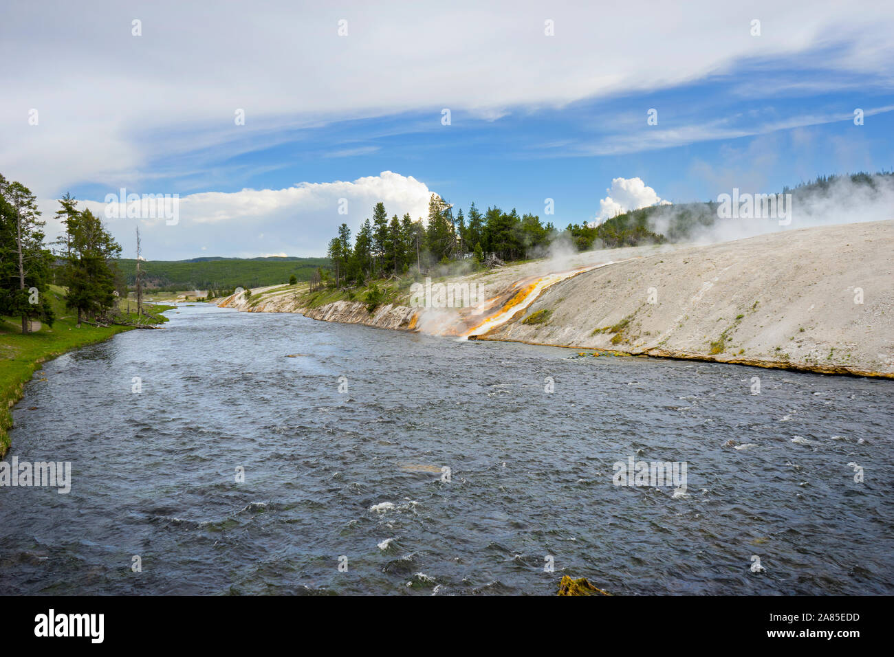 Firehole River with colorful drainage channel from Excelsior Geyser Stock Photo