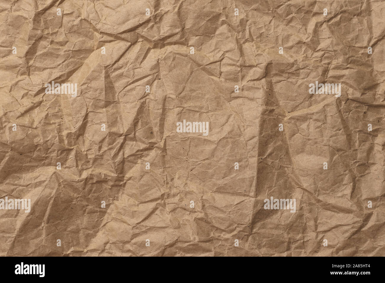 Crumpled brown paper, old rough texture. Wrinkled parchment, crinkle