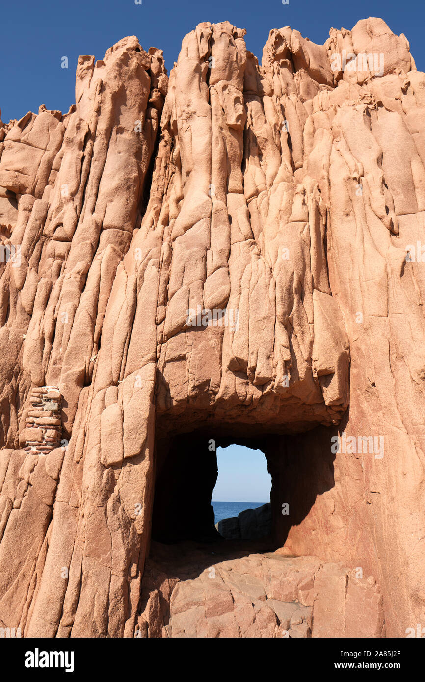 The square hole cut through the Rocce rosse / Porphyry Red Rocks