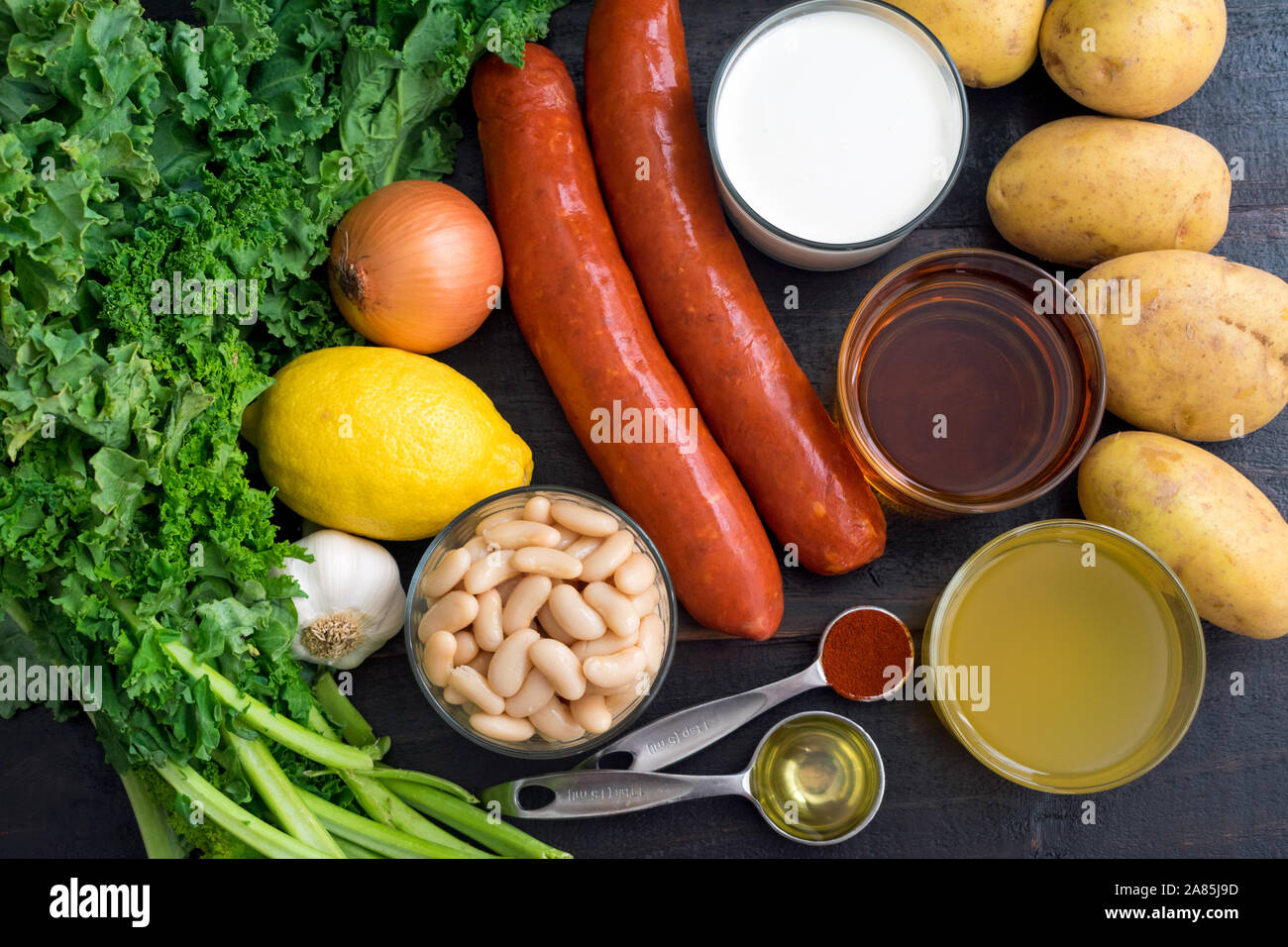 Portuguese Caldo Verde Soup Ingredients: Sausage, kale, potatoes, and other ingredients used to make a traditional Portuguese soup Stock Photo
