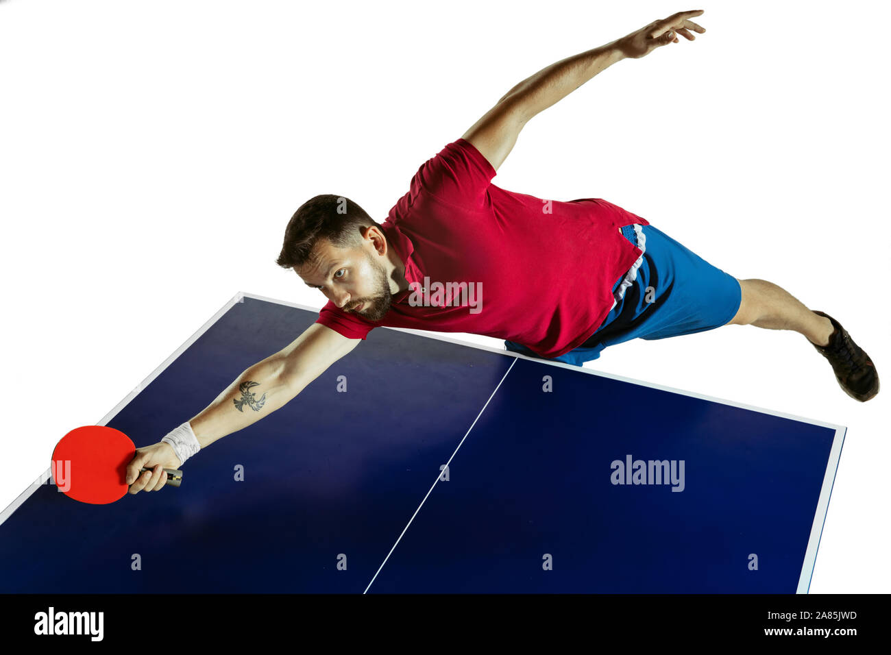 Strained. Young man plays table tennis on white studio background. Model  plays ping pong. Concept of leisure activity, sport, human emotions in  gameplay, healthy lifestyle, motion, action, movement Stock Photo - Alamy