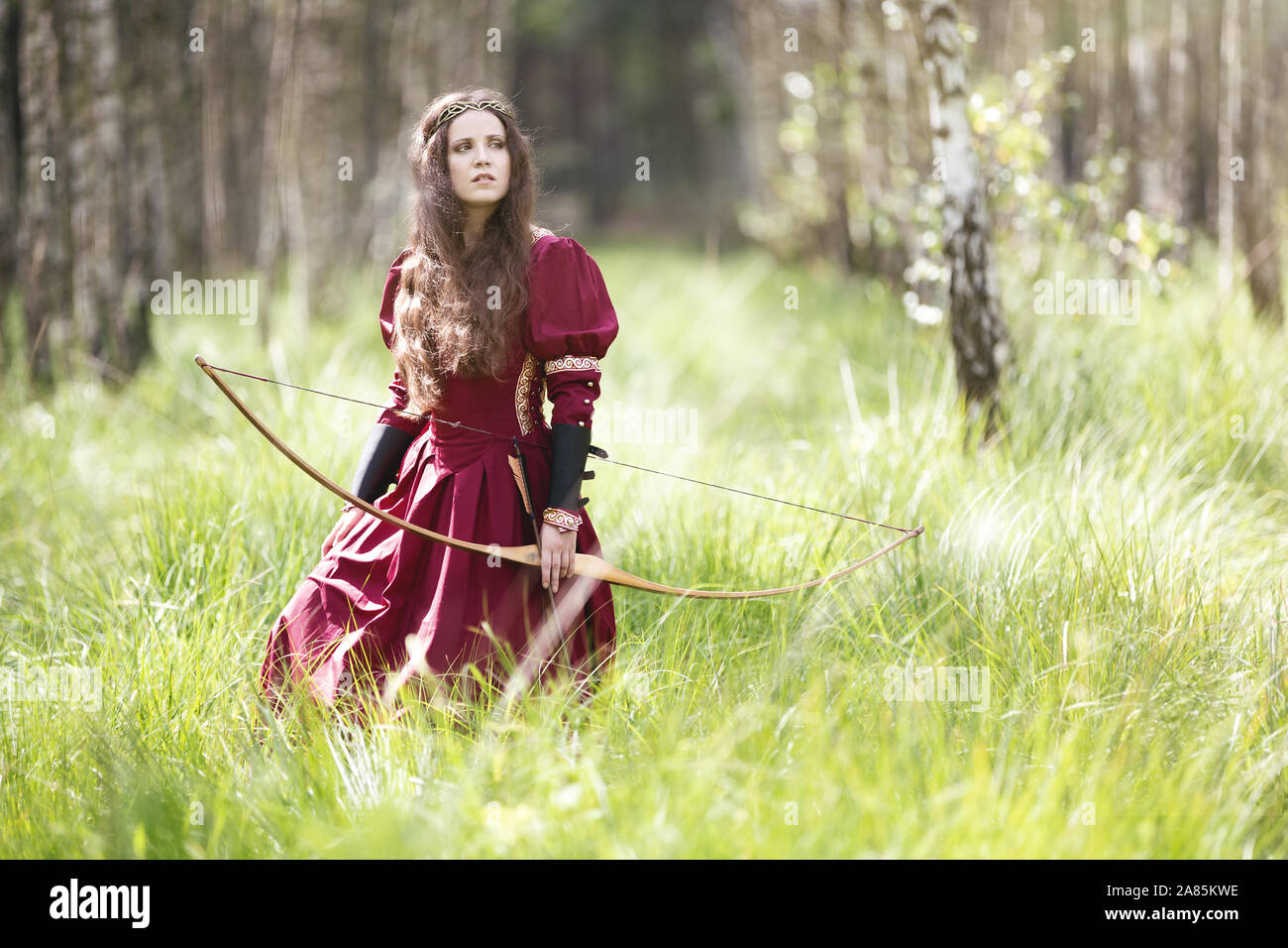 An elf archer with a bow in the woods Stock Photo