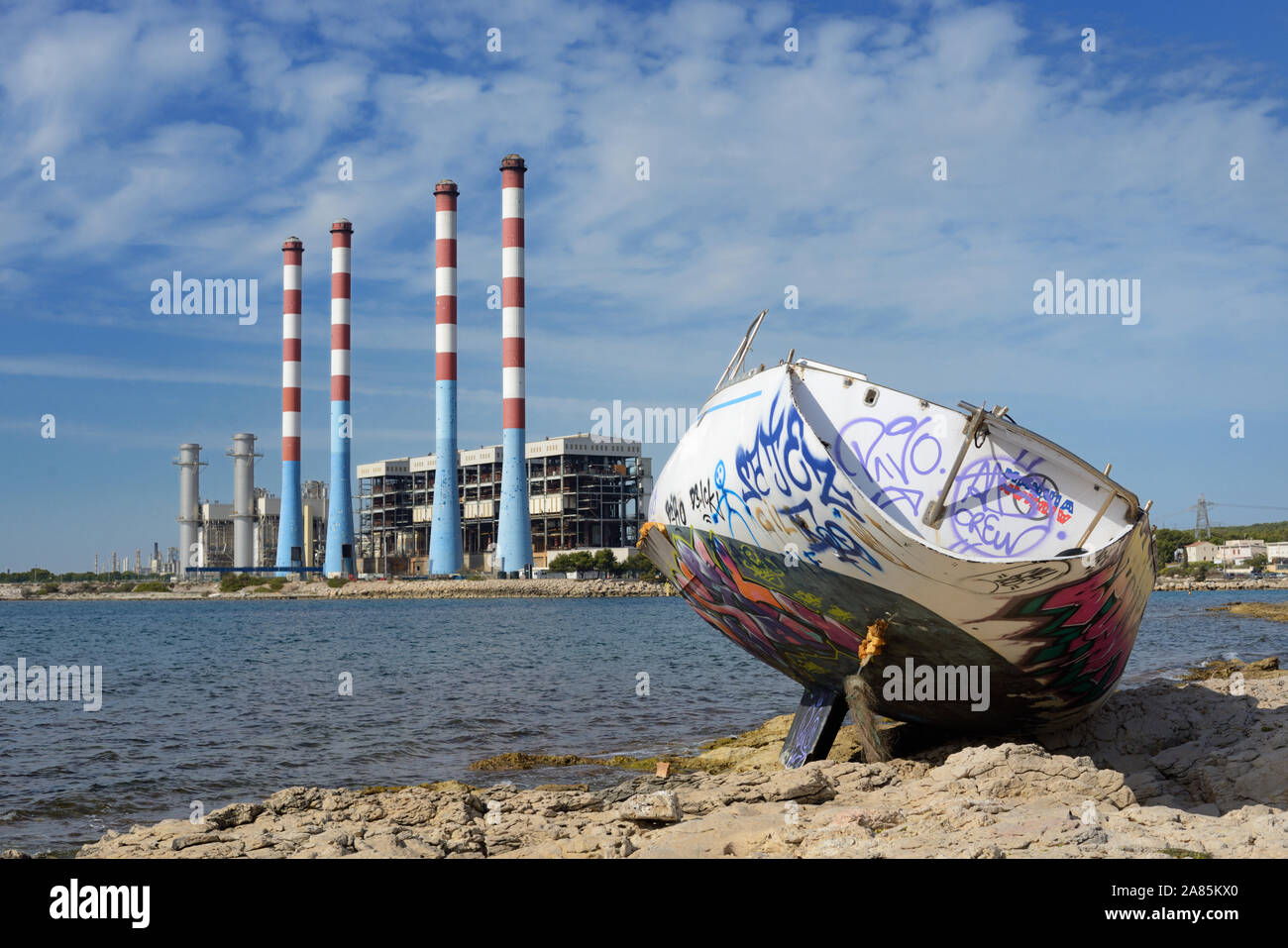 Beached, Shipwreck or Shipwrecked Yacht in front of EDF Thermal Power Station Ponteau & Anse de Laurons Martigues Provence France Stock Photo