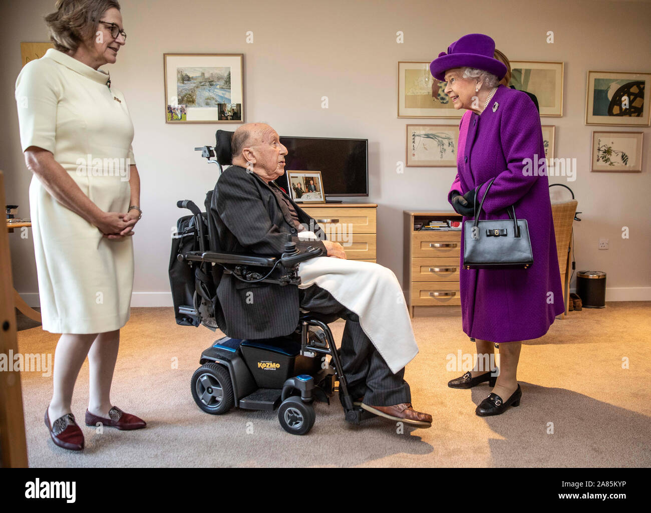 Queen Elizabeth II meets with world war two veteran and former 'Chindit' from the Burma campaign John Riggs, aged 98 years, in his new apartment in he new Appleton Lodge care facility run by the RBLI. The Queen visited the Royal British Legion Industries village in Aylesford, Kent, to celebrate the charity's centenary year. Stock Photo
