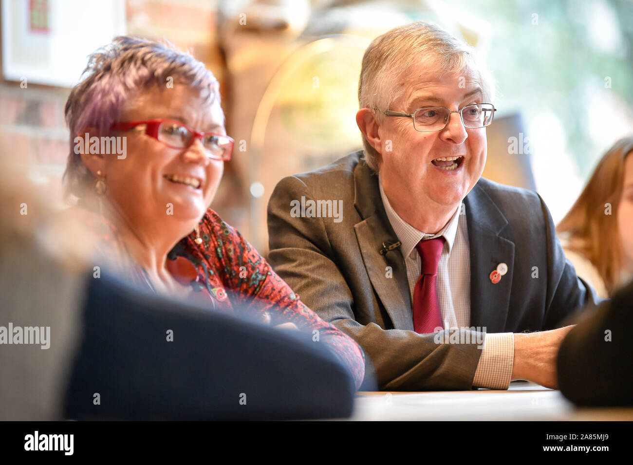 Welsh Labour Leader Mark Drakeford AM, and Deputy Leader Carolyn Harris MP chat with students at the ACT Training Centre at the launch of the Welsh Labour Party campaign in Cardiff. Stock Photo