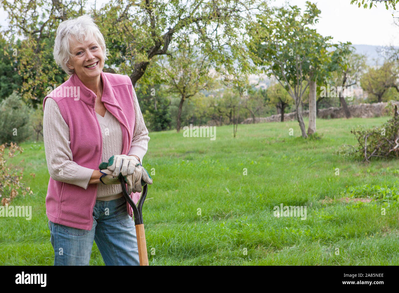 Old woman gardening hi-res stock photography and images - Alamy