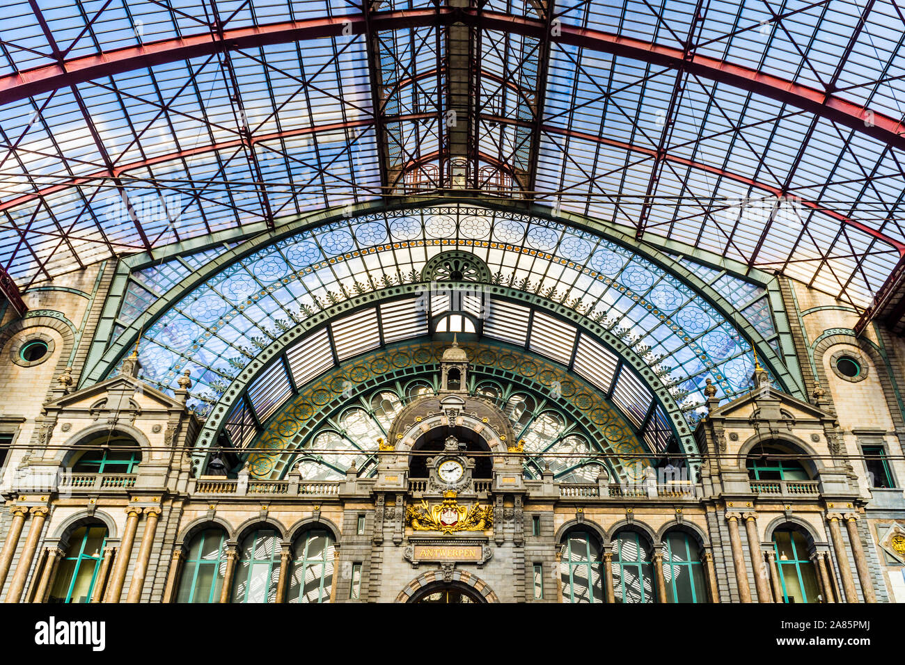Interior of upper level of Antwerp Central railway station with iron and glass roof - Belgium. Stock Photo