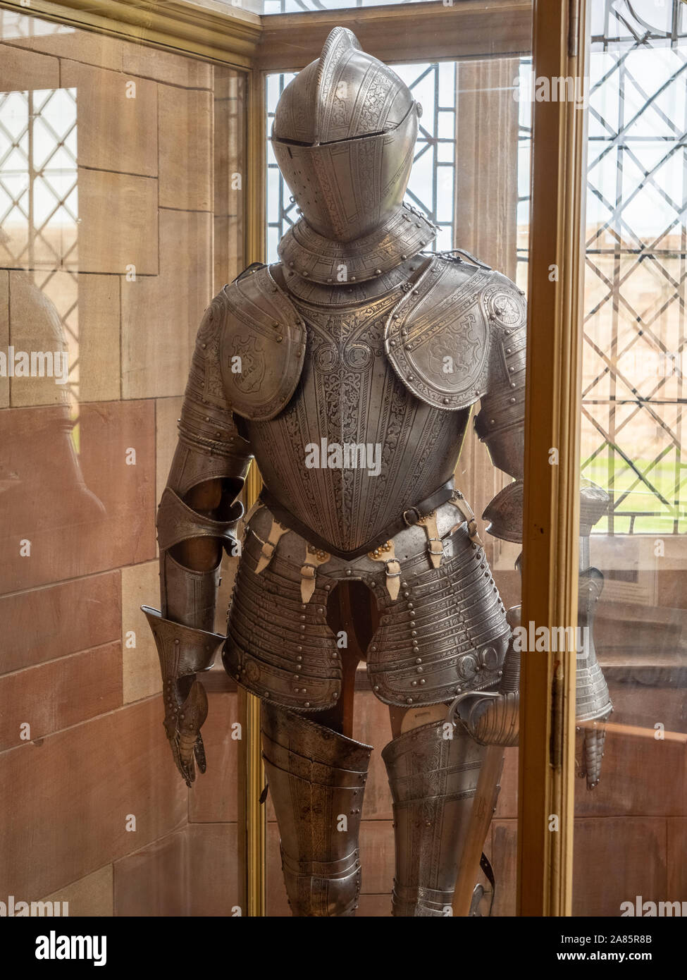 Suit of armour in display case at Bamburgh Castle, Northumberland, UK Stock  Photo - Alamy