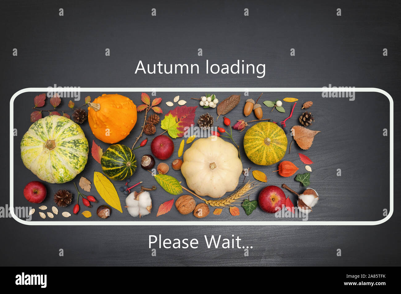 Conceptual icon autumn loading on black table Stock Photo