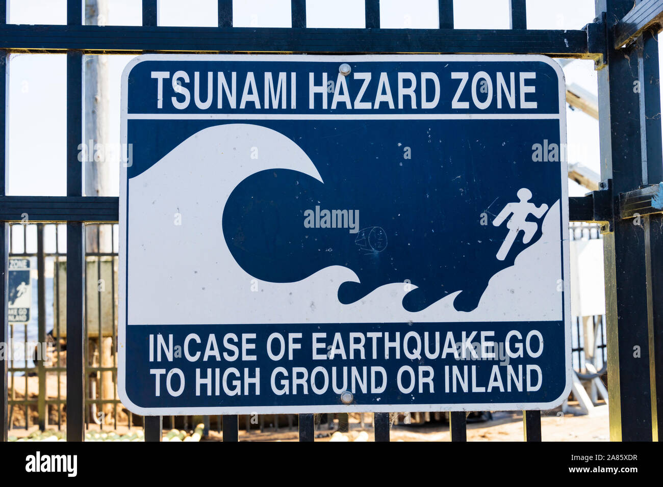 Tsunami warning sign on the railings at Coast Guards pier, Monterey, California, United States of America. Stock Photo