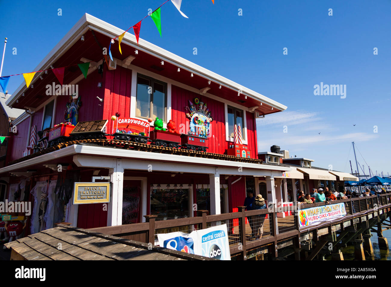 Candy World store, Monterey Wharf pier, crowds of tourists. Monterey, California, United States of America. Stock Photo