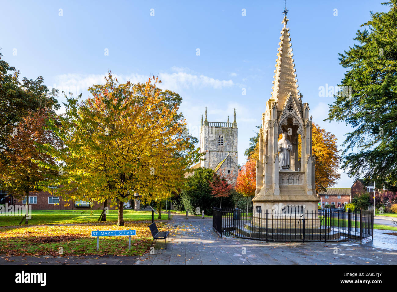 St Mary de Lode church and Bishop Hoopers Monument in autumn in St Marys Square, Gloucester UK Stock Photo
