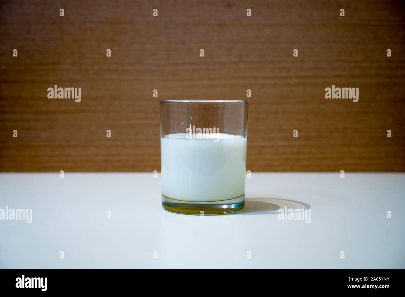 Glass beaker full of milk on the table Stock Photo Alamy