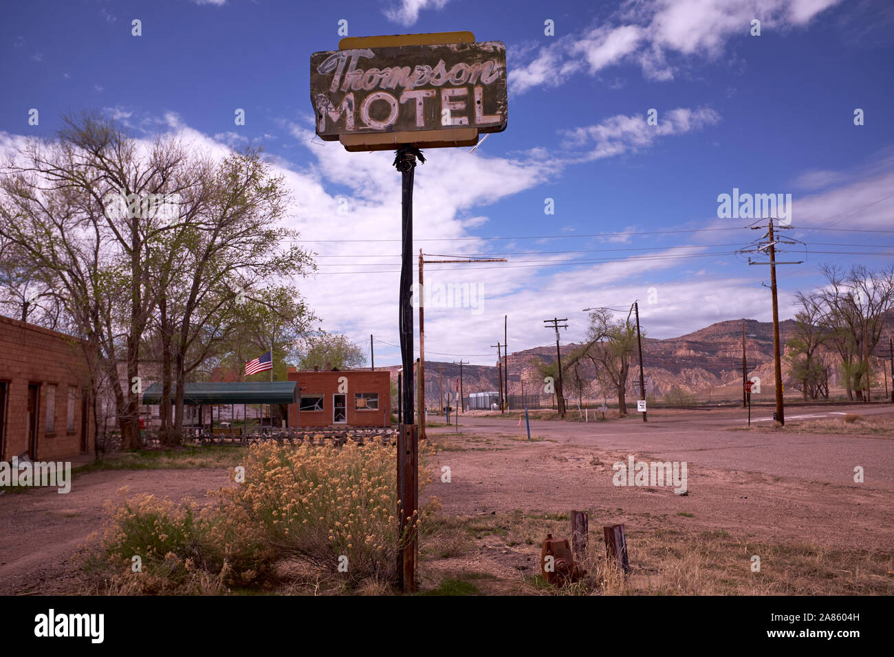 Abandoned and derelict motel sign by the railway line in Thompson Springs, Utah, USA Stock Photo