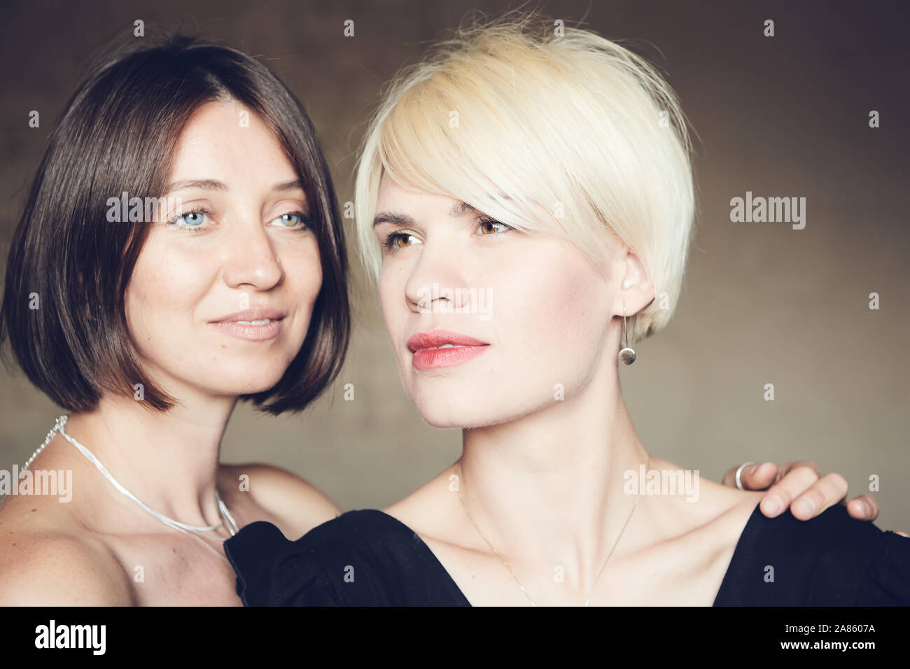 Portrait Of Two Attractive Caucasian Smiling Women Blonde And