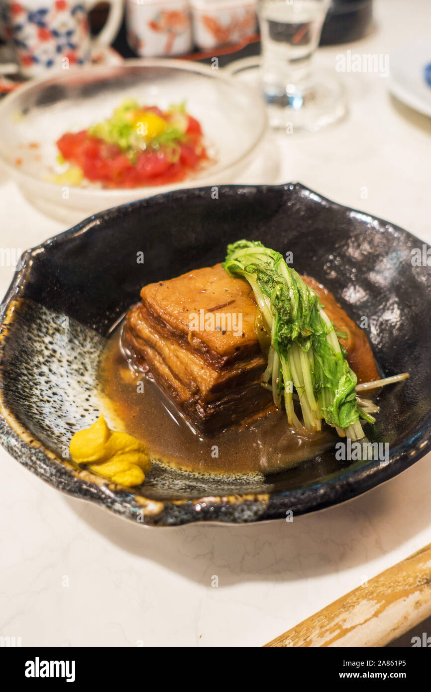 Braised pork belly at Osaka Izakaya Stock Photo