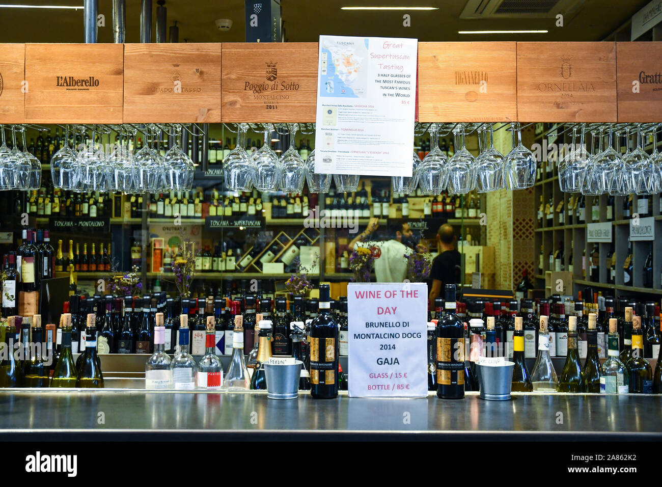 Counter of a winery with a wide selection of Tuscan wines at San Lorenzo Central Market in the historic centre of Florence, Tuscany, Italy Stock Photo