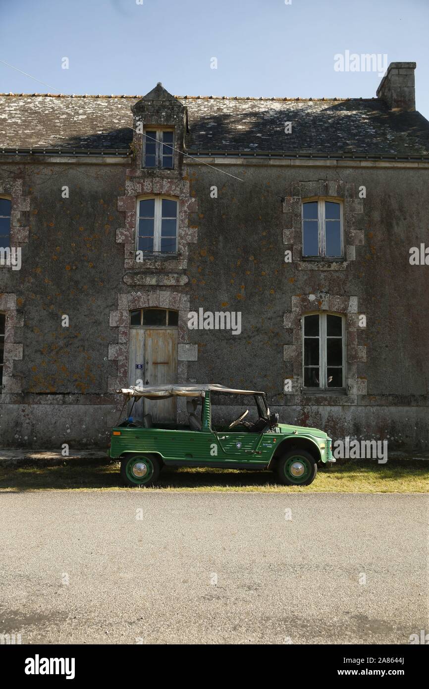 Green Mehari and old house in Brittany, France Stock Photo