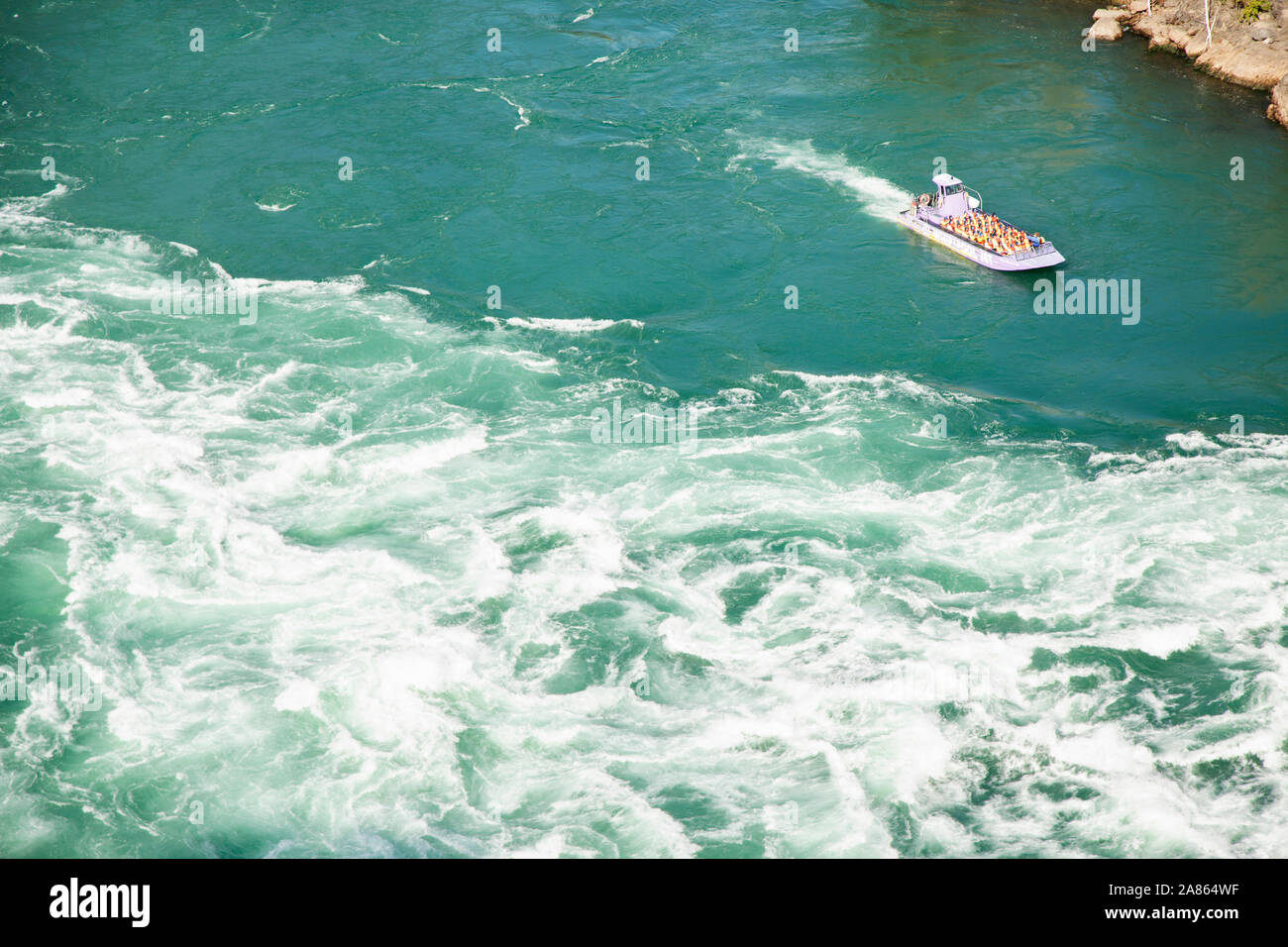 OCTOBER 20, 2019-NIAGARA FALLS, CANADA: The Whirlpool Jet offers rides into the Niagara River Whirlpool area where people can witness the power of the Stock Photo