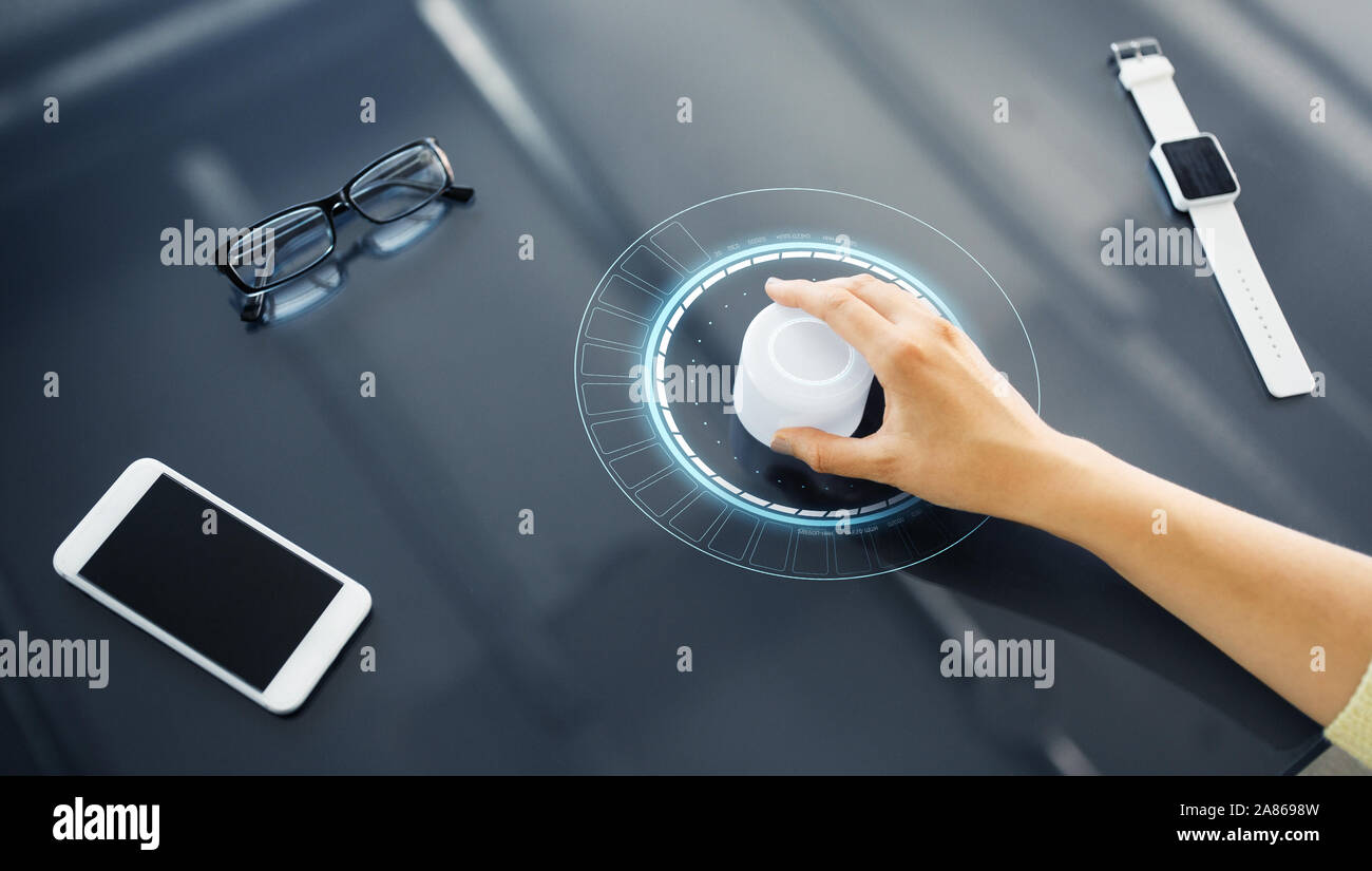 hand with control knob on interactive panel Stock Photo