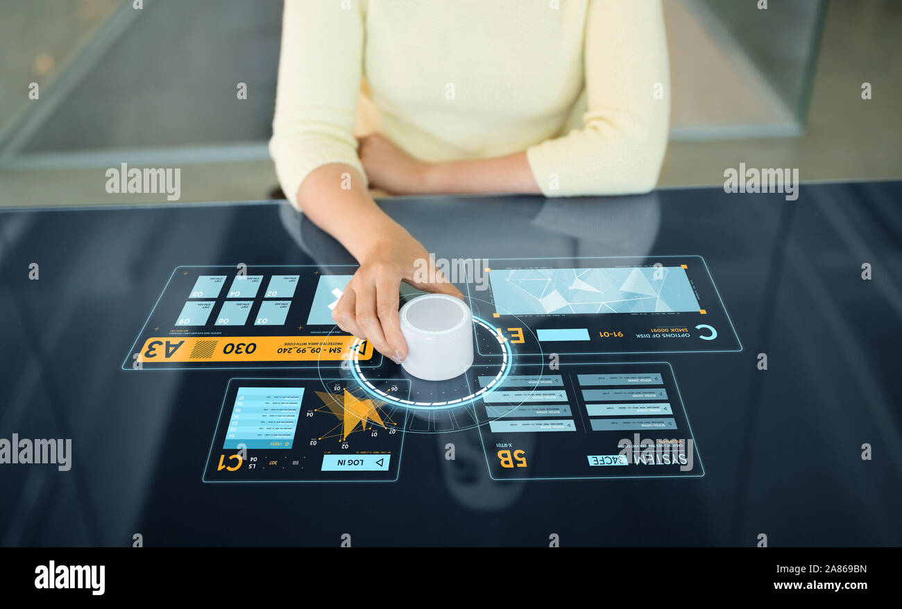 woman with control knob on interactive panel Stock Photo