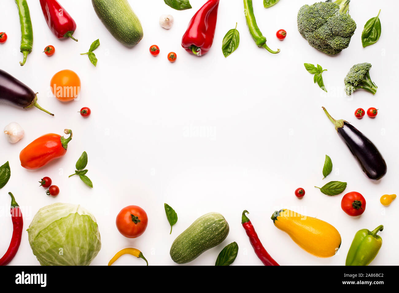 Frame of colored organic vegetables on white Stock Photo - Alamy