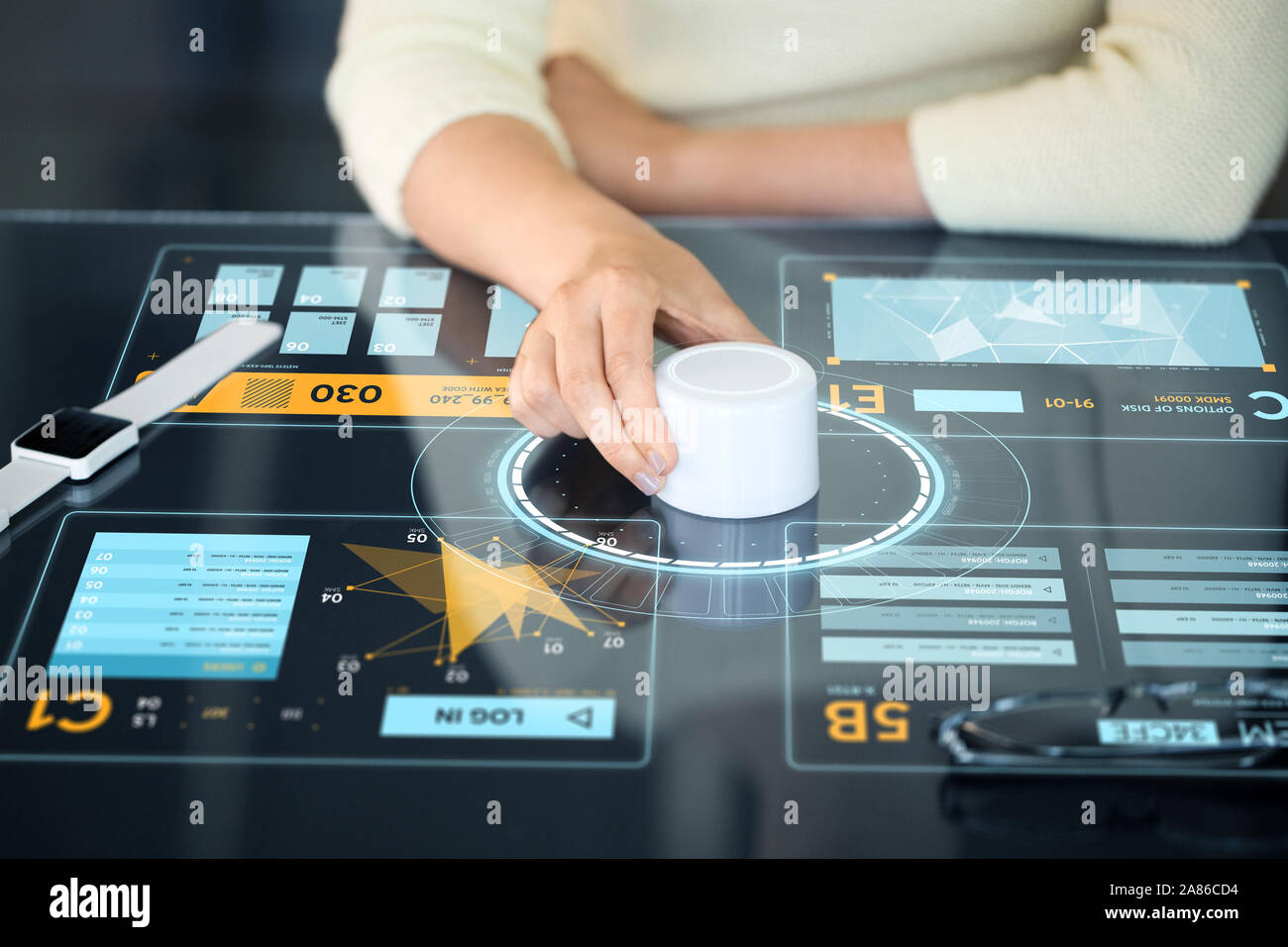 woman with control knob on interactive panel Stock Photo