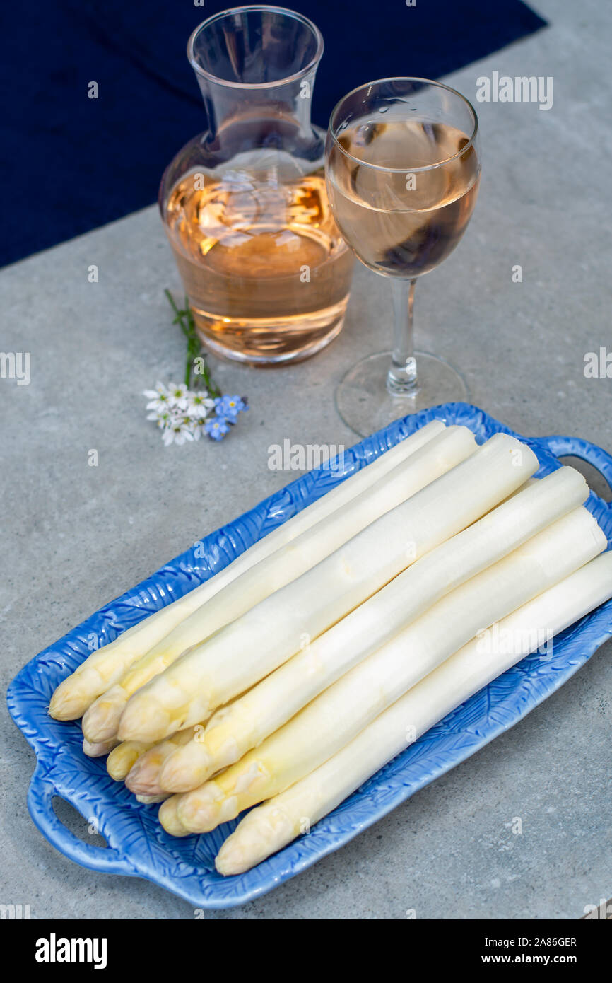 Fresh raw washed and peeled white asparagus vegetables ready to cook