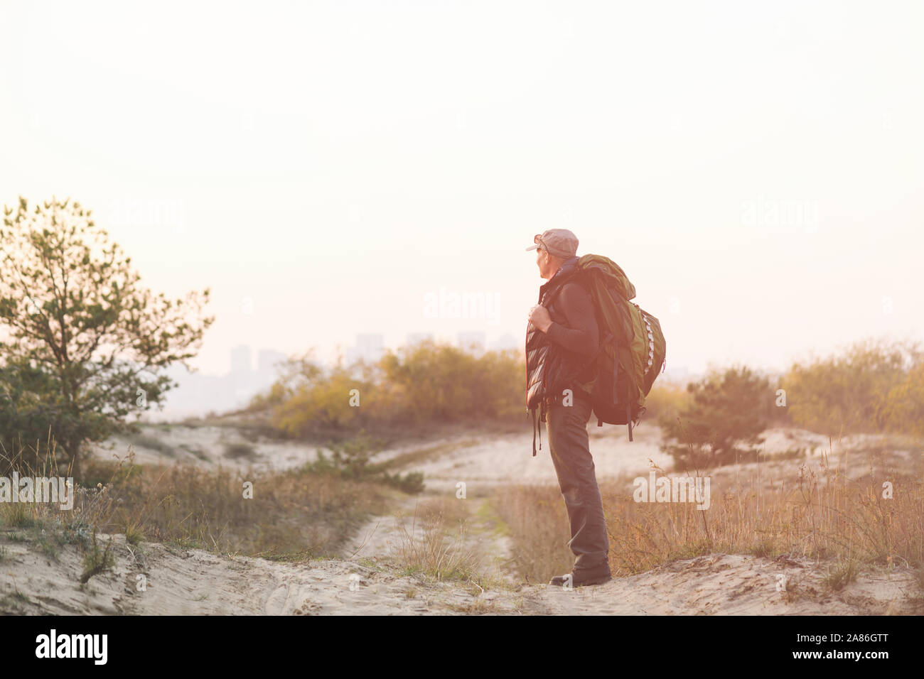 Senior man backpack bag walks hi-res stock photography and images - Alamy