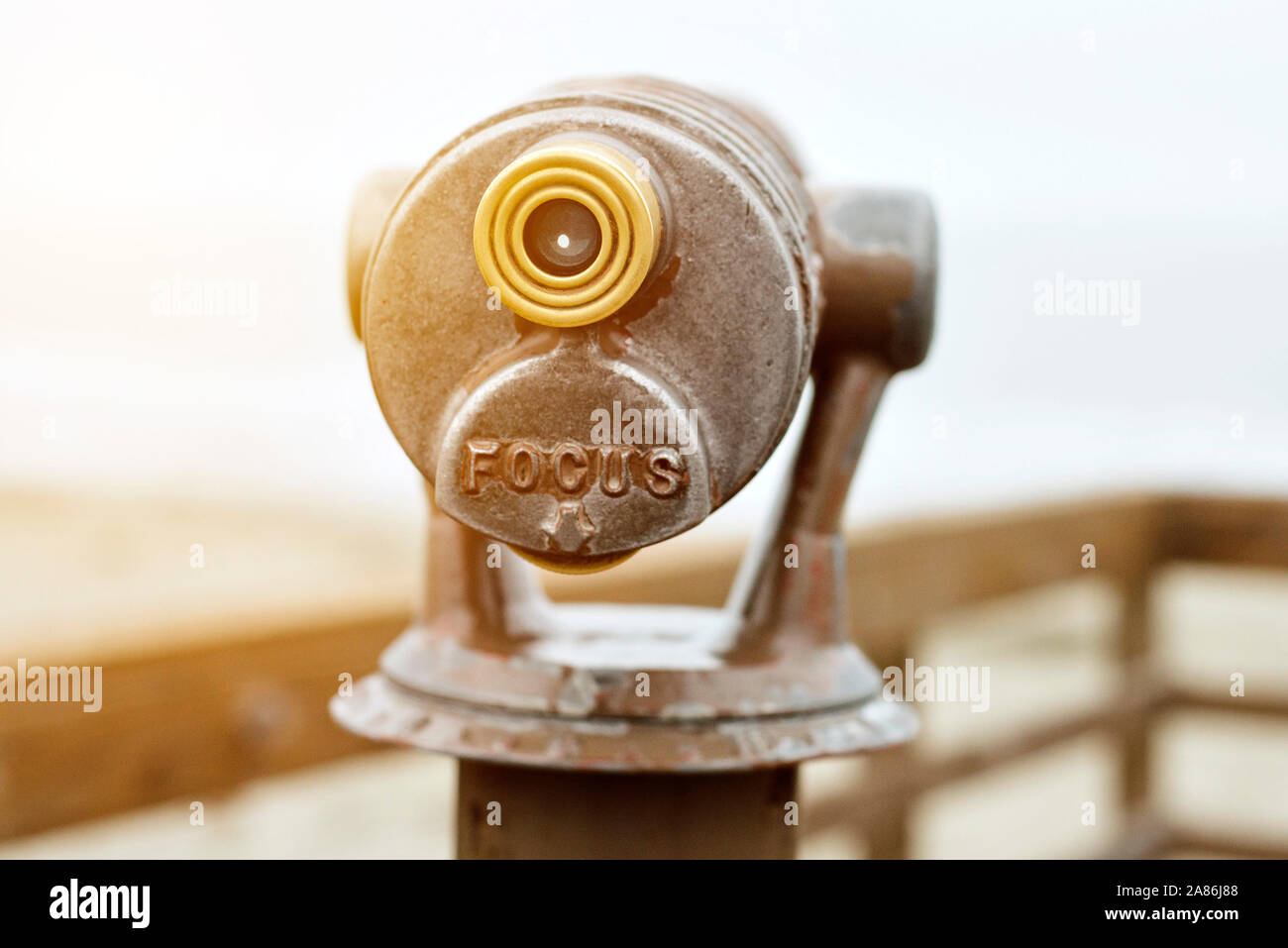 Beach telescope for tourists with the words Focus and warm lighting Stock Photo