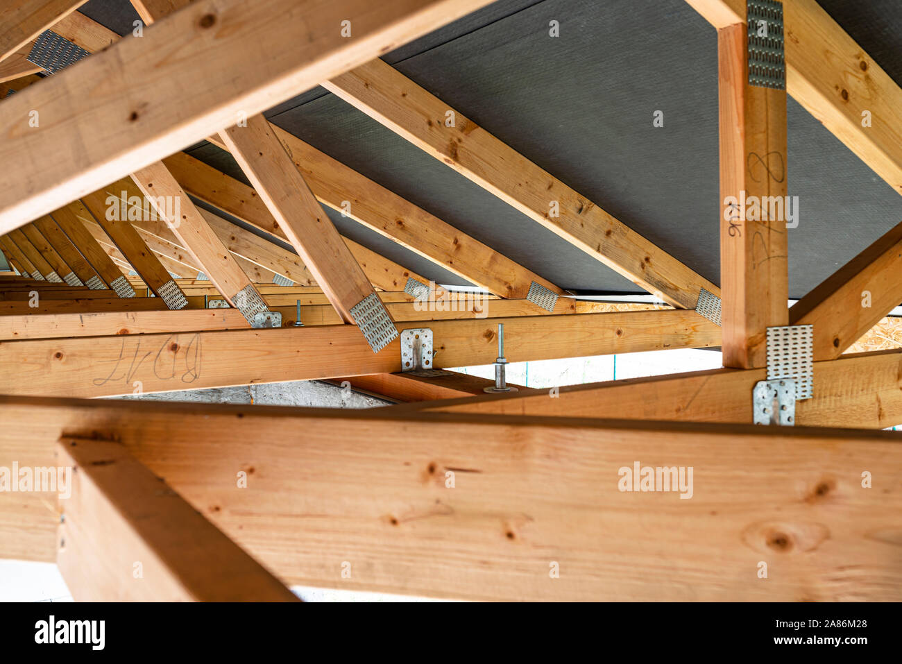 Roof trusses covered with a membrane on a detached house under