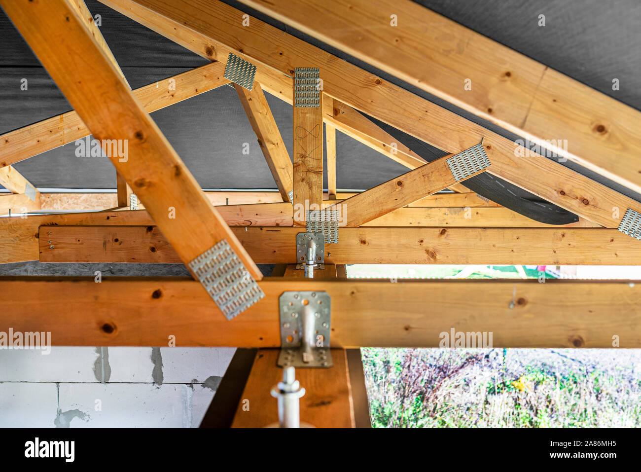 Roof Trusses Covered With A Membrane On A Detached House Under Roof Trusses Covered With A Membrane On A Detached House Under