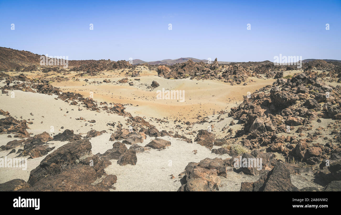Panorama view of the Teide National Park. Rocks of volcanic origin and sand in Tenerife island, Canary Islands in Spain. Desert lunar landscape Stock Photo