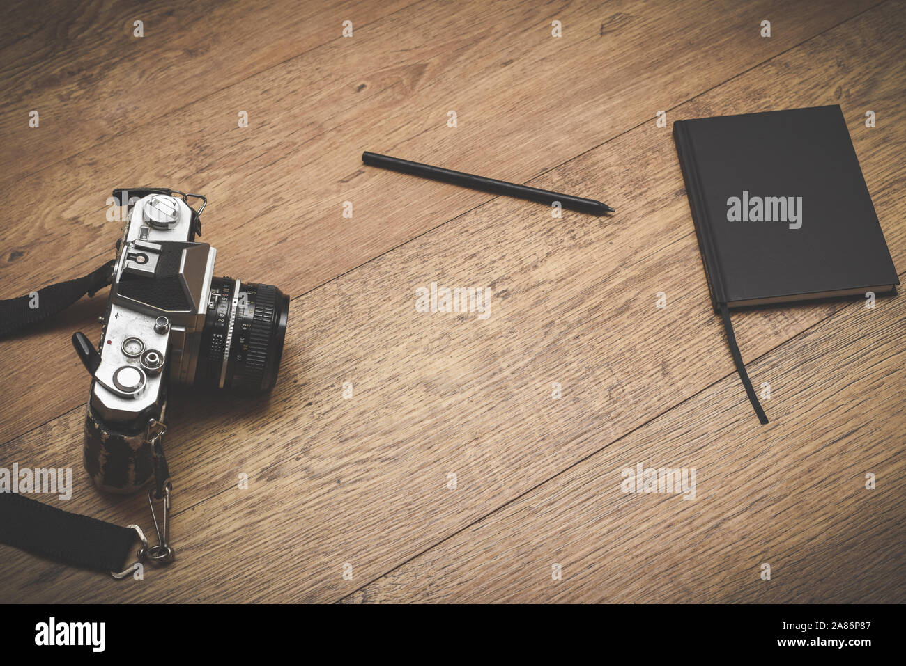 Retro style objects for blogging photography and writing on vintage wooden background Stock Photo