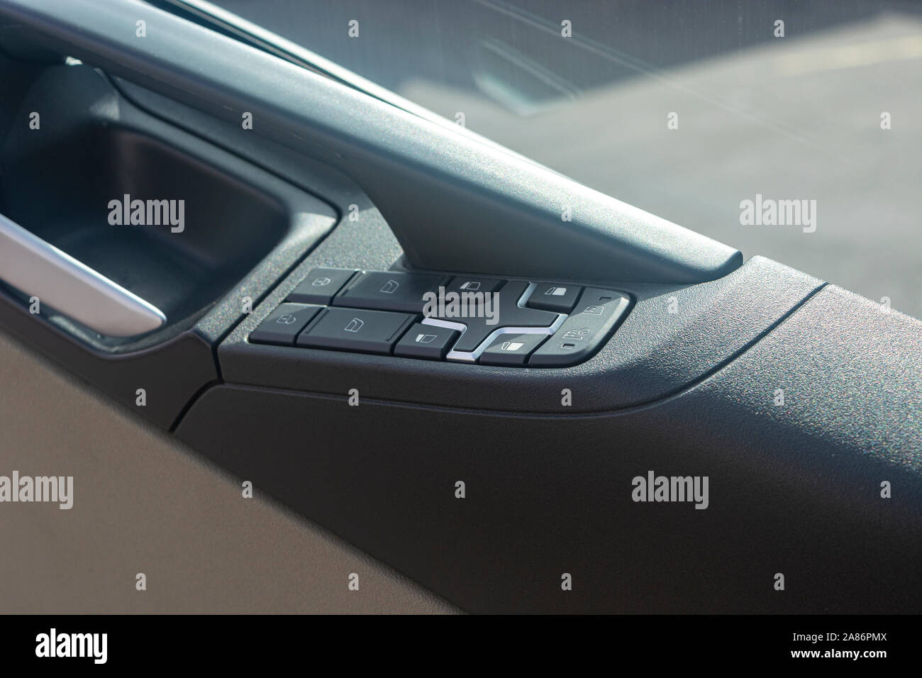 Car door handle with control buttons closeup Stock Photo Alamy