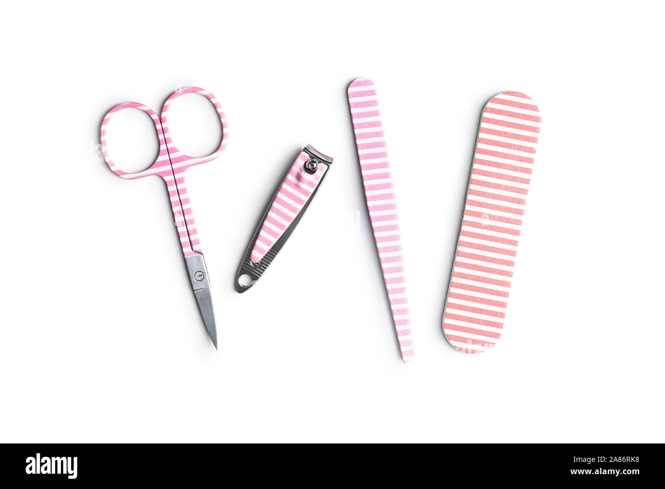 Pink manicure tools. Nail scissors and accessories isolated on white background. Stock Photo