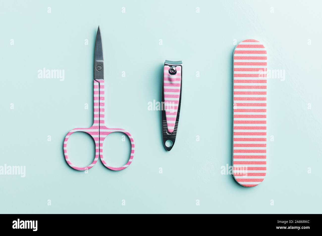 Pink manicure tools. Nail scissors and accessories. Top view. Stock Photo
