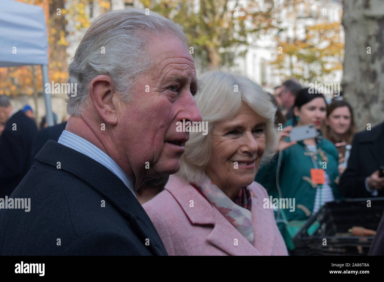Prince Charles and Camilla the Duchess of Cornwall at the Swiss Cottage farmers market, meeting stall holders. Its is the 20th anniversary of London Farmers Market. 2019  2010s HOMER SYKES Stock Photo