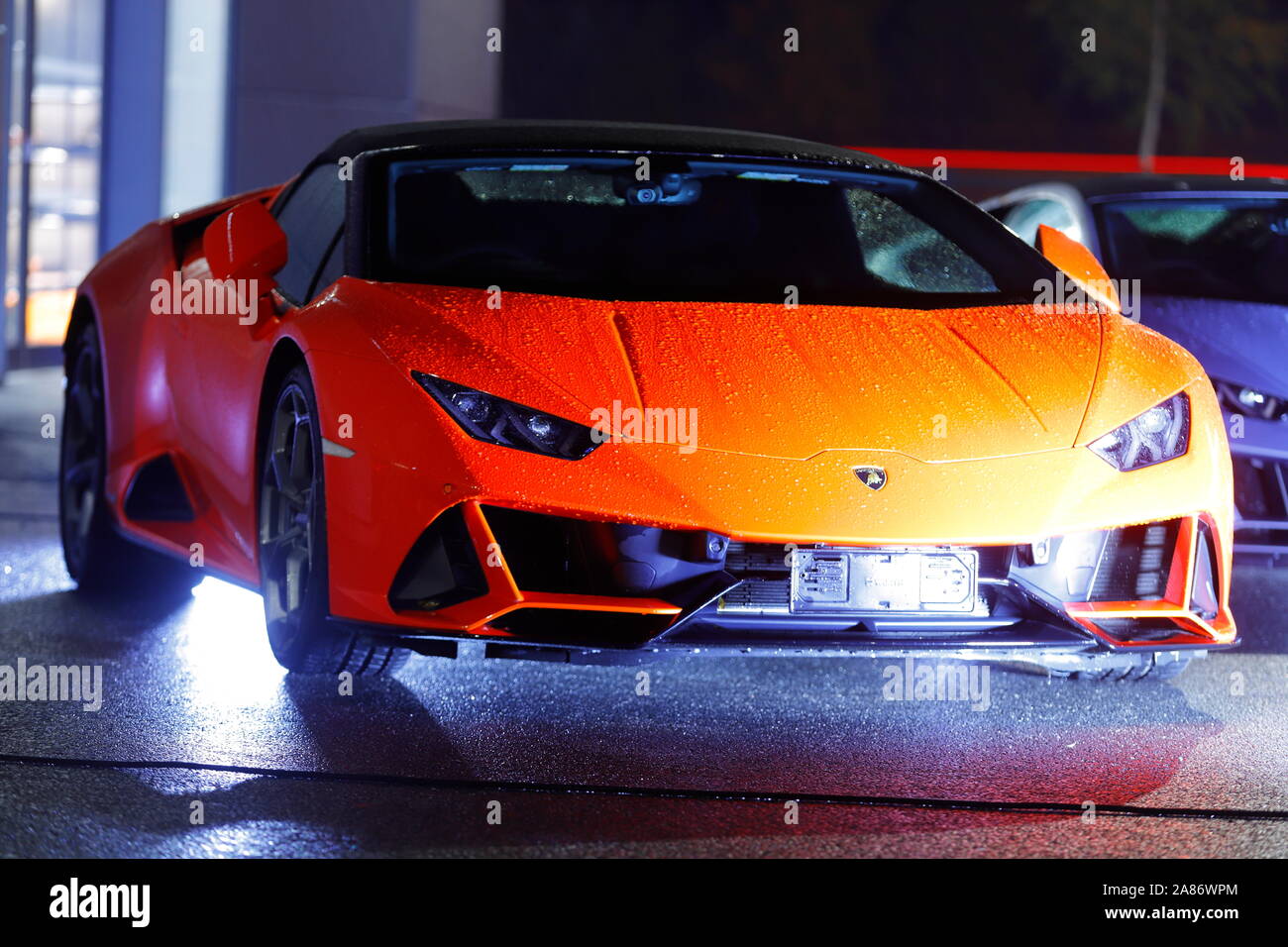 Lamborghinis lit up at night for a private event at the new Lamborghini dealership in Leeds. The store officially opened on 7th November. Stock Photo