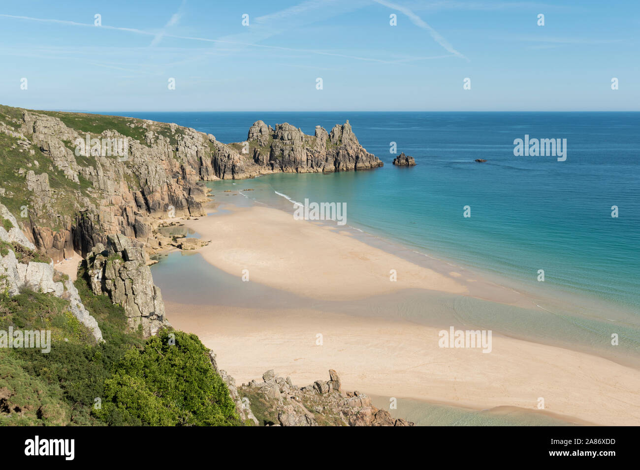 The crystal clear waters of Pedn Vounder as viewed from the clifftop South West Coast Path above the beach, Cornwall. Stock Photo