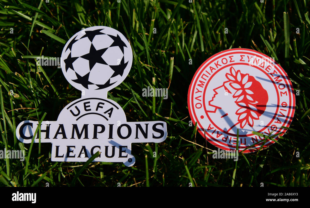 September 6, 2019 Istanbul, Turkey. The emblem of the Greek football club  Olympiacos Piraeus next to the logo of the Champions League on the green gra  Stock Photo - Alamy