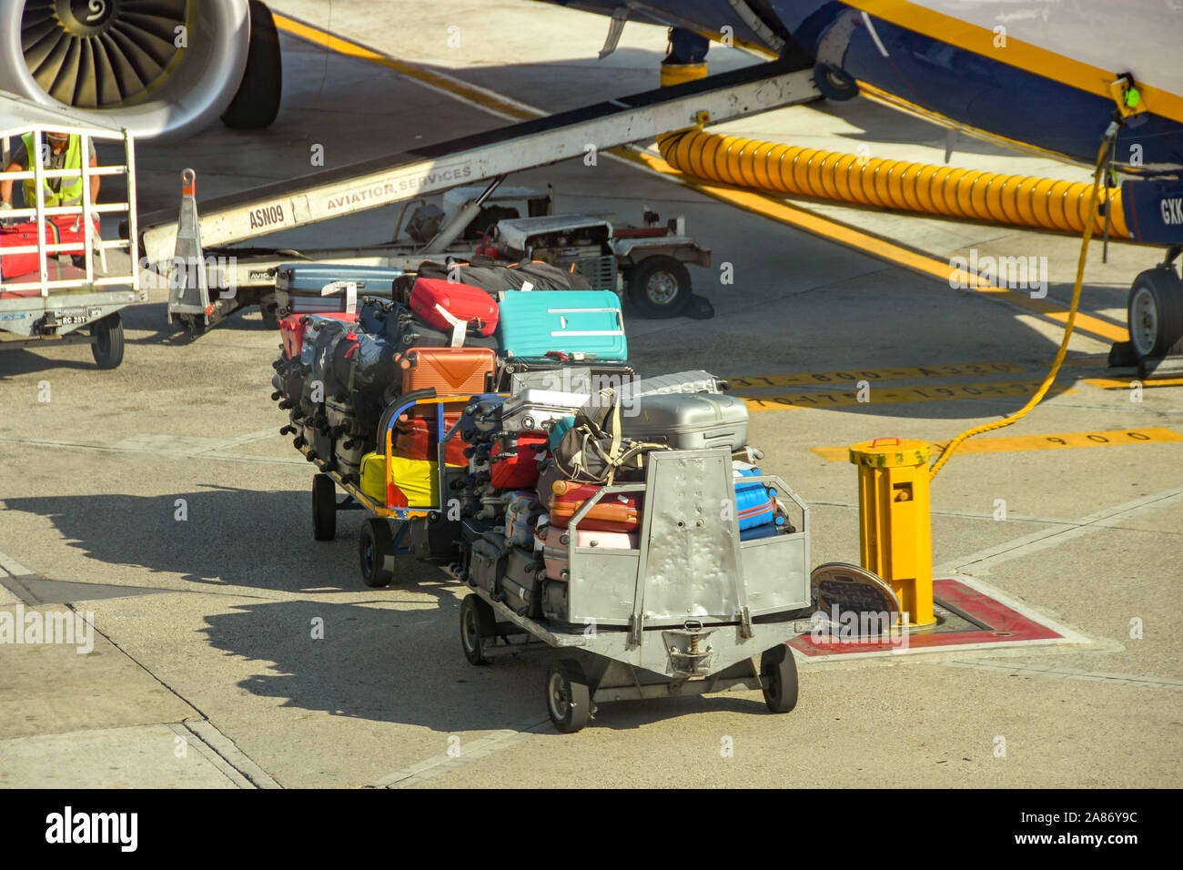 NAPLES AIRPORT, ITALY AUGUST 2019 Suitcases piled up on luggage