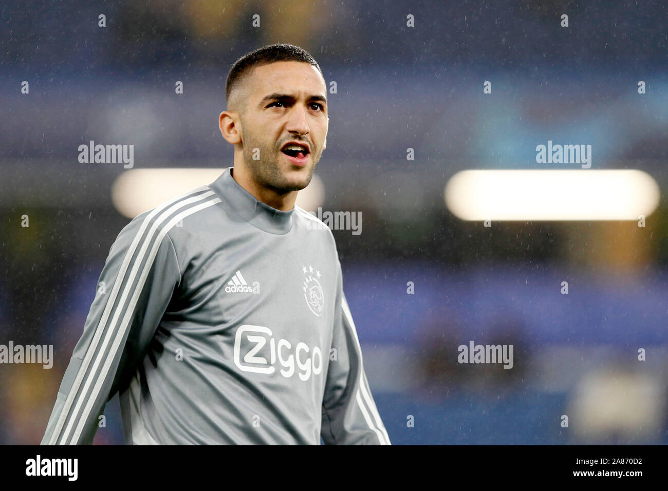 London, UK. 05th Nov, 2019. Hakim Ziyech of Ajax Amsterdam warms up during  the UEFA Champions League group match between Chelsea and Ajax at Stamford  Bridge, London, England on 5 November 2019.