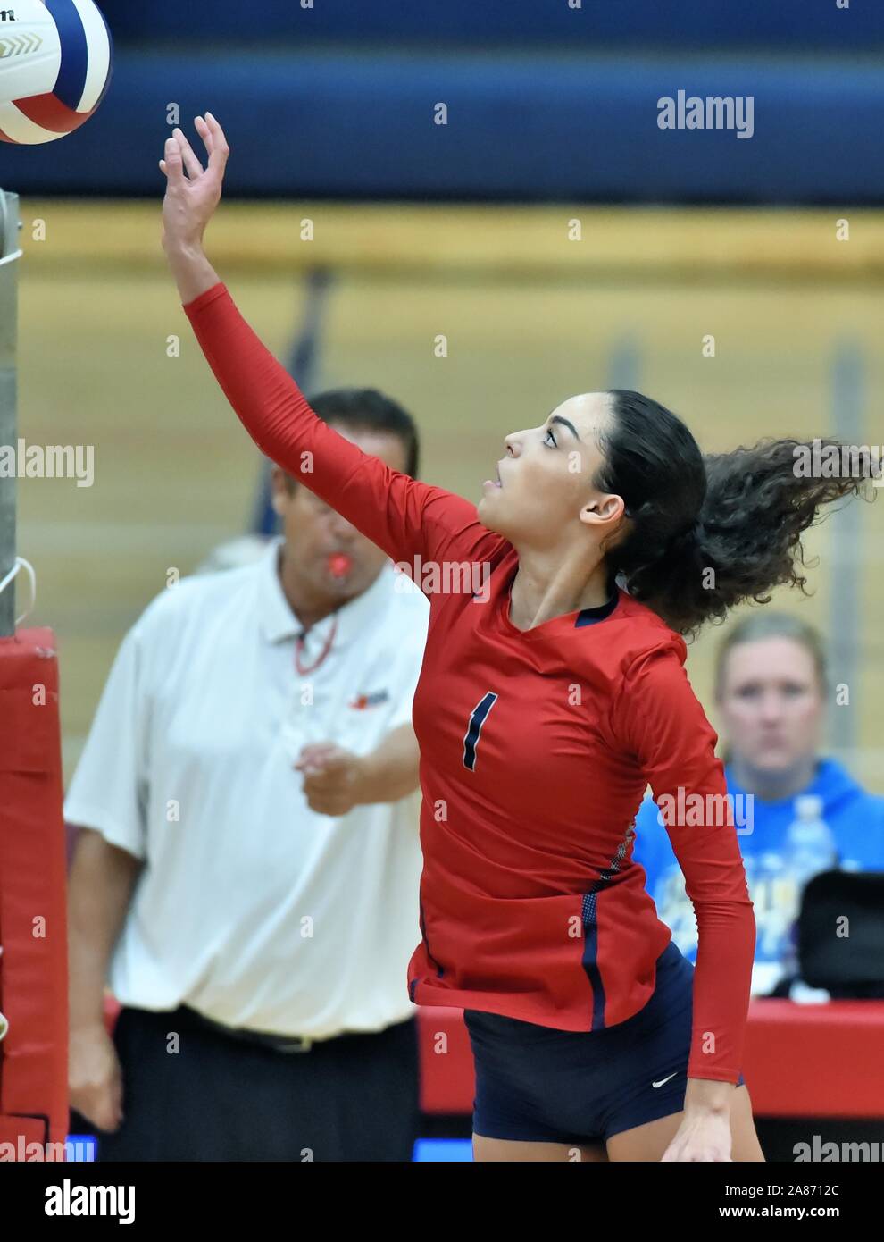 Player directing a drop shot return over the net. USA. Stock Photo