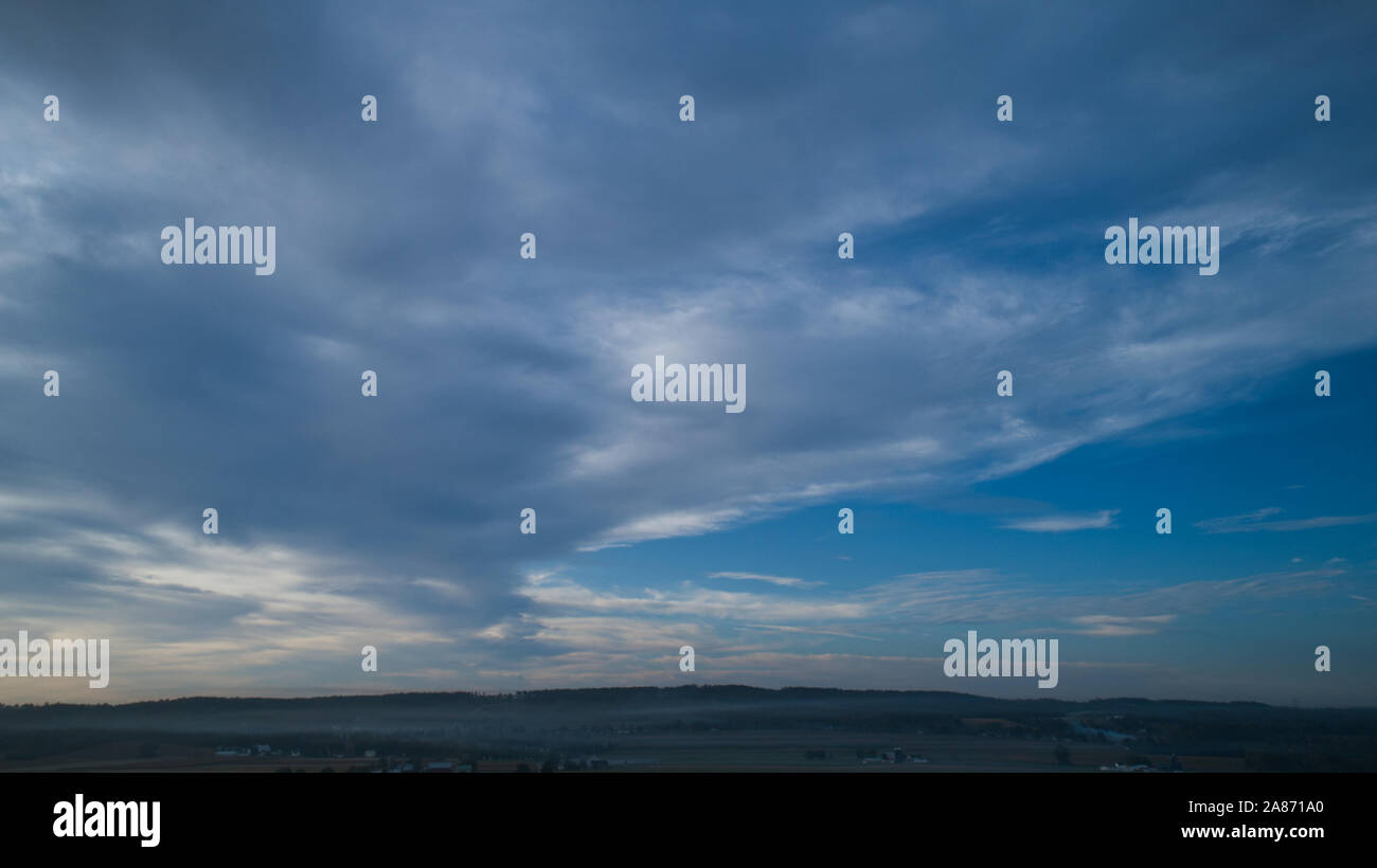 Aerial View of a Late Afternoon Sun With Partly Cloudy Blue Sky Over ...