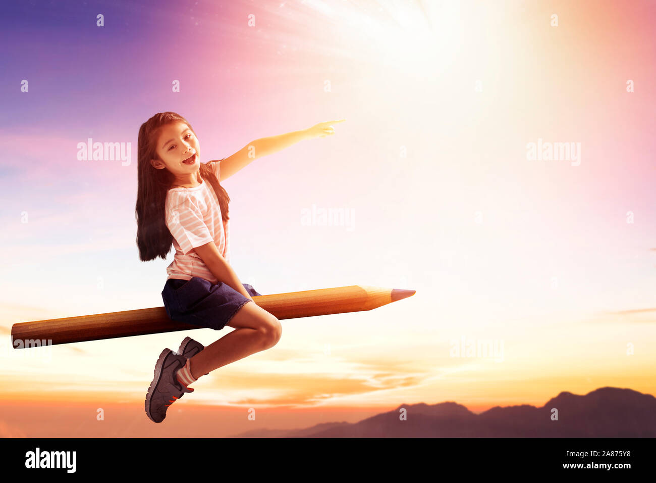 happy little girl on pencil and flying in the sky Stock Photo - Alamy