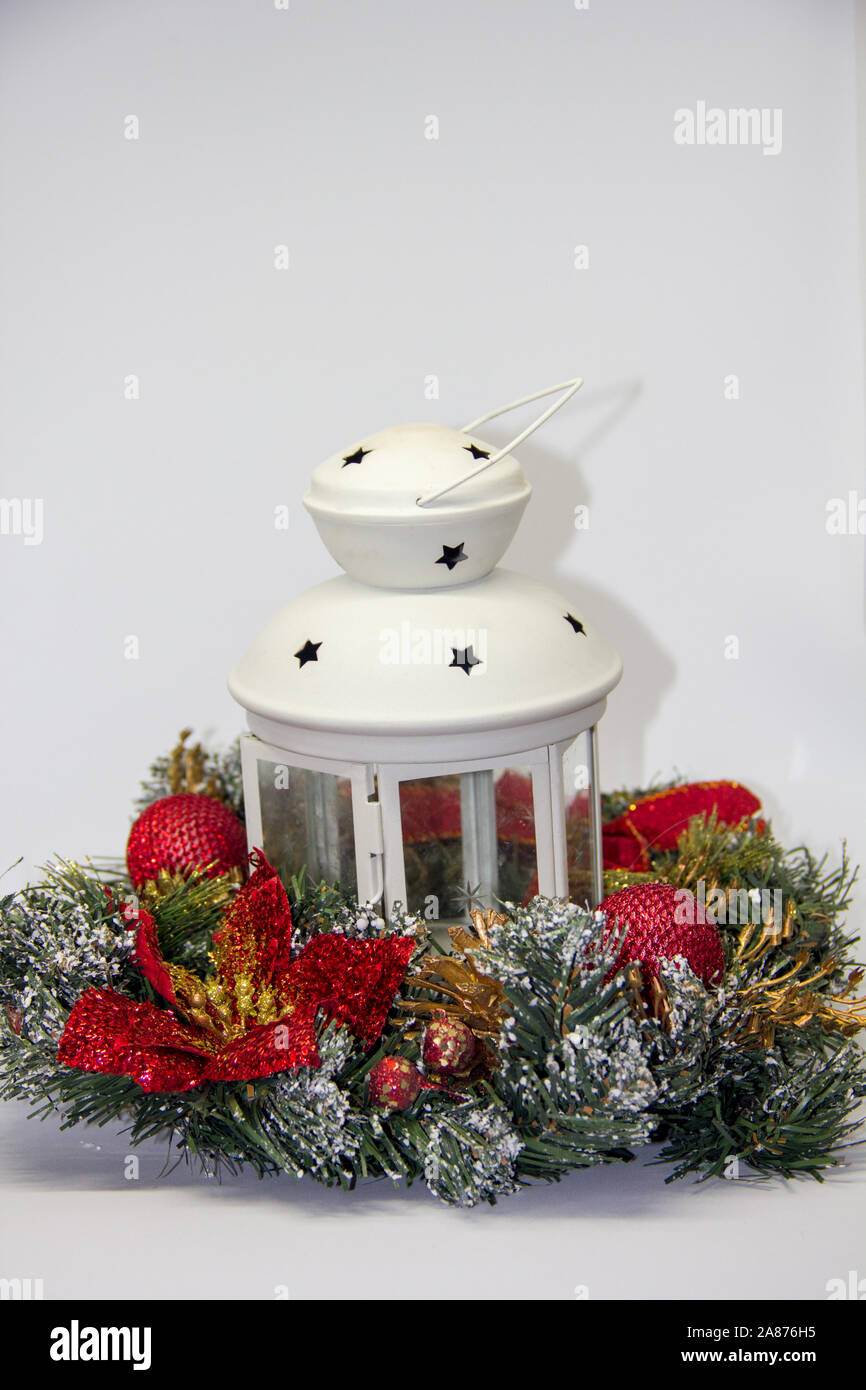 Christmas wreath lantern with fire on a white background Stock Photo