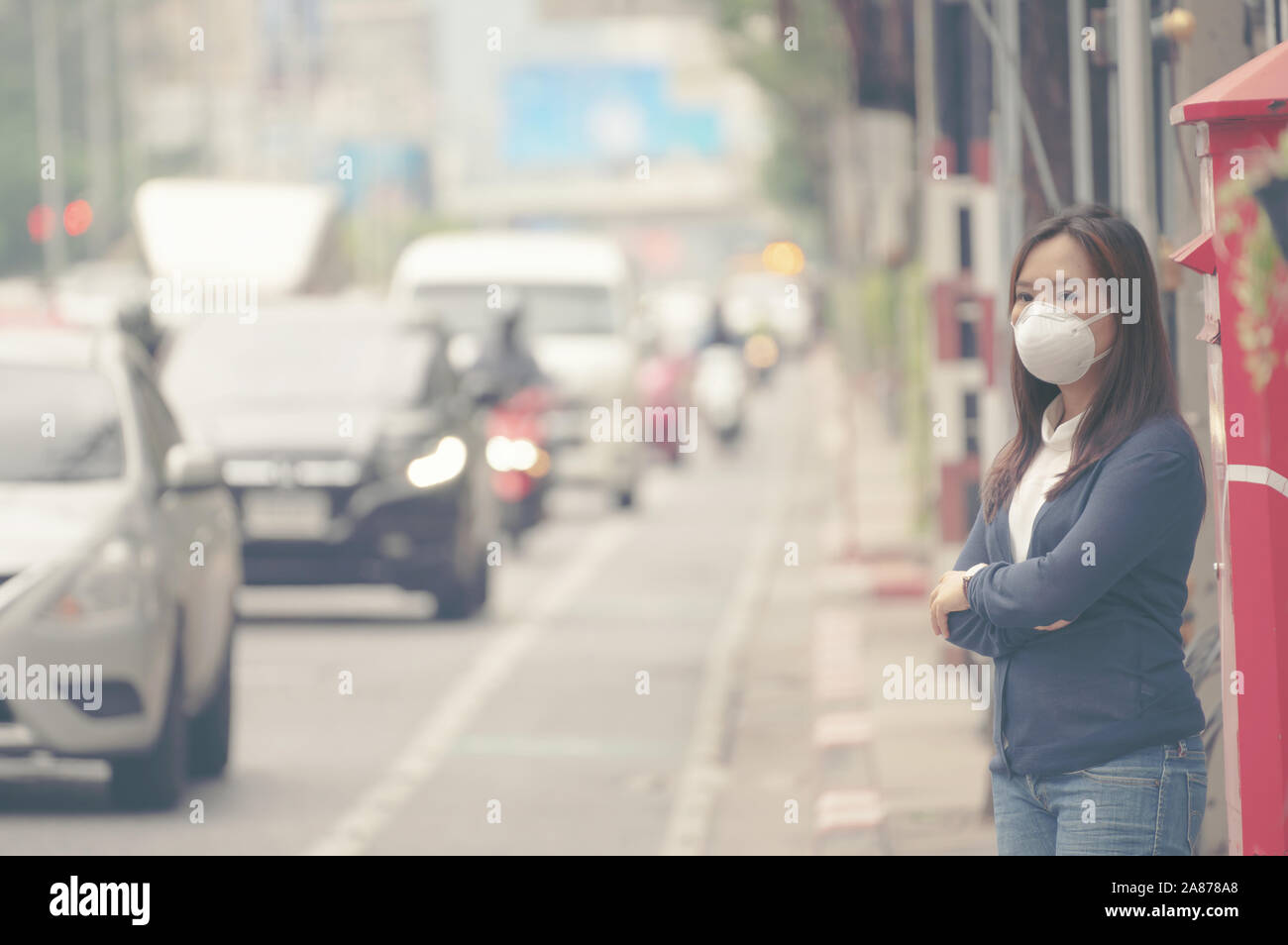 woman wearing protective mask in the city street, Bangkok thailand Stock Photo